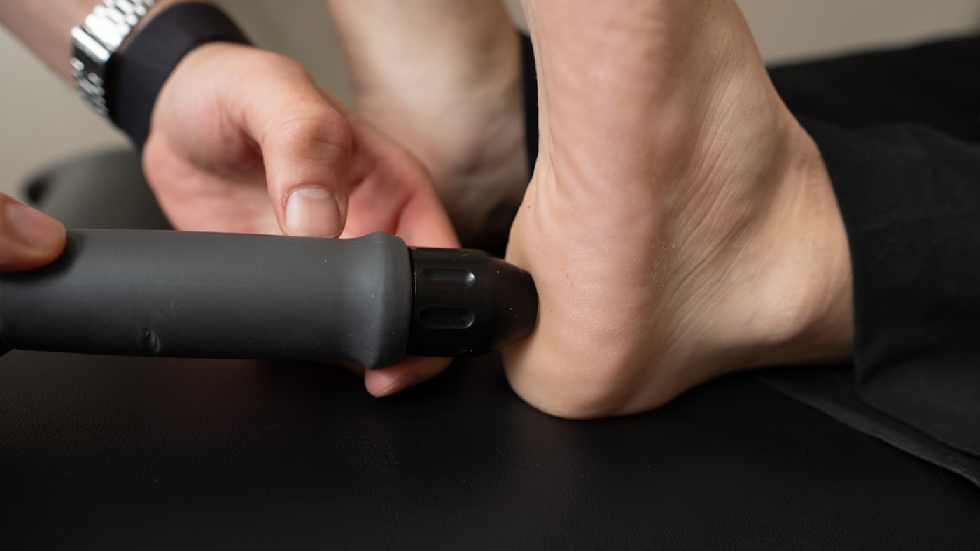 Close-up of a therapist treating a patient's heel and ankle